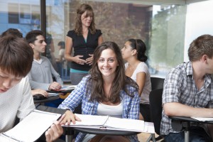 Student at Desk with Notebook